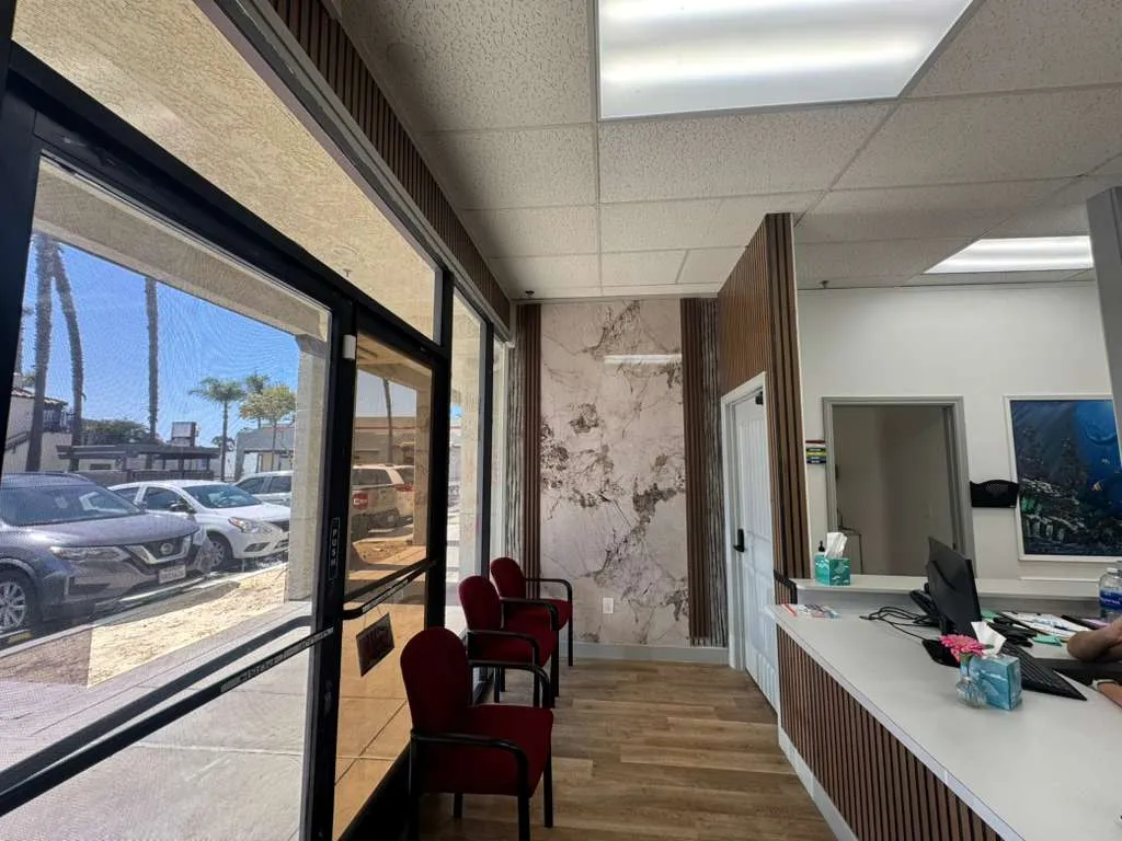 Modern marble wall reception at San Ysidro urgent care