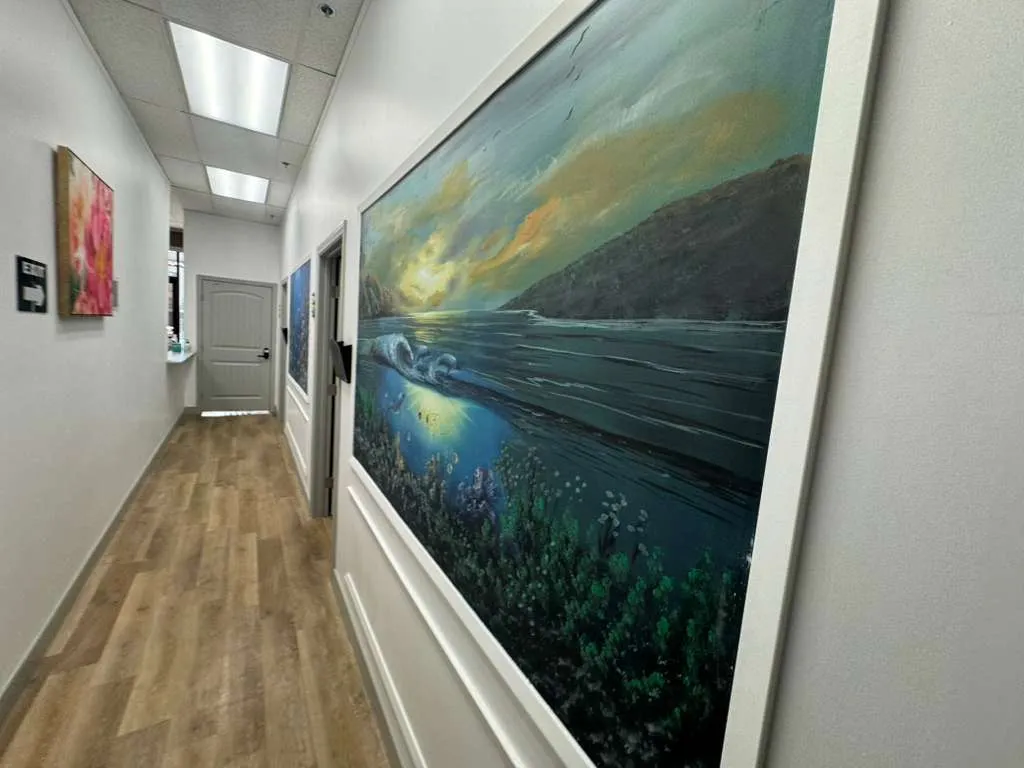 Calm art-decorated therapy hallway at Palm Urgent Care mental health clinic San Diego